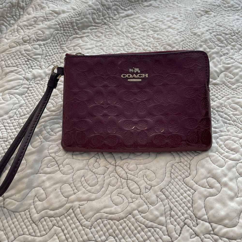 Burgundy signature patent leather Coach Wristlet